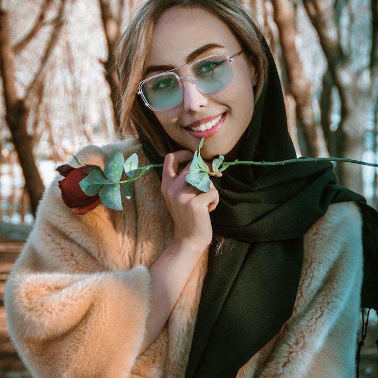 Kaveri Mehta, Lead Design Curator at Mosaic Pebble Park, reviewing corporate floral arrangements